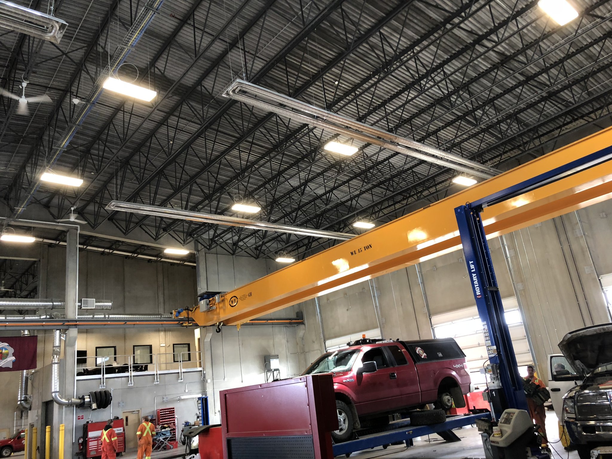 Radiant tube heater in the Taber Municipal District vehicle shop, mounted overhead along the service bay